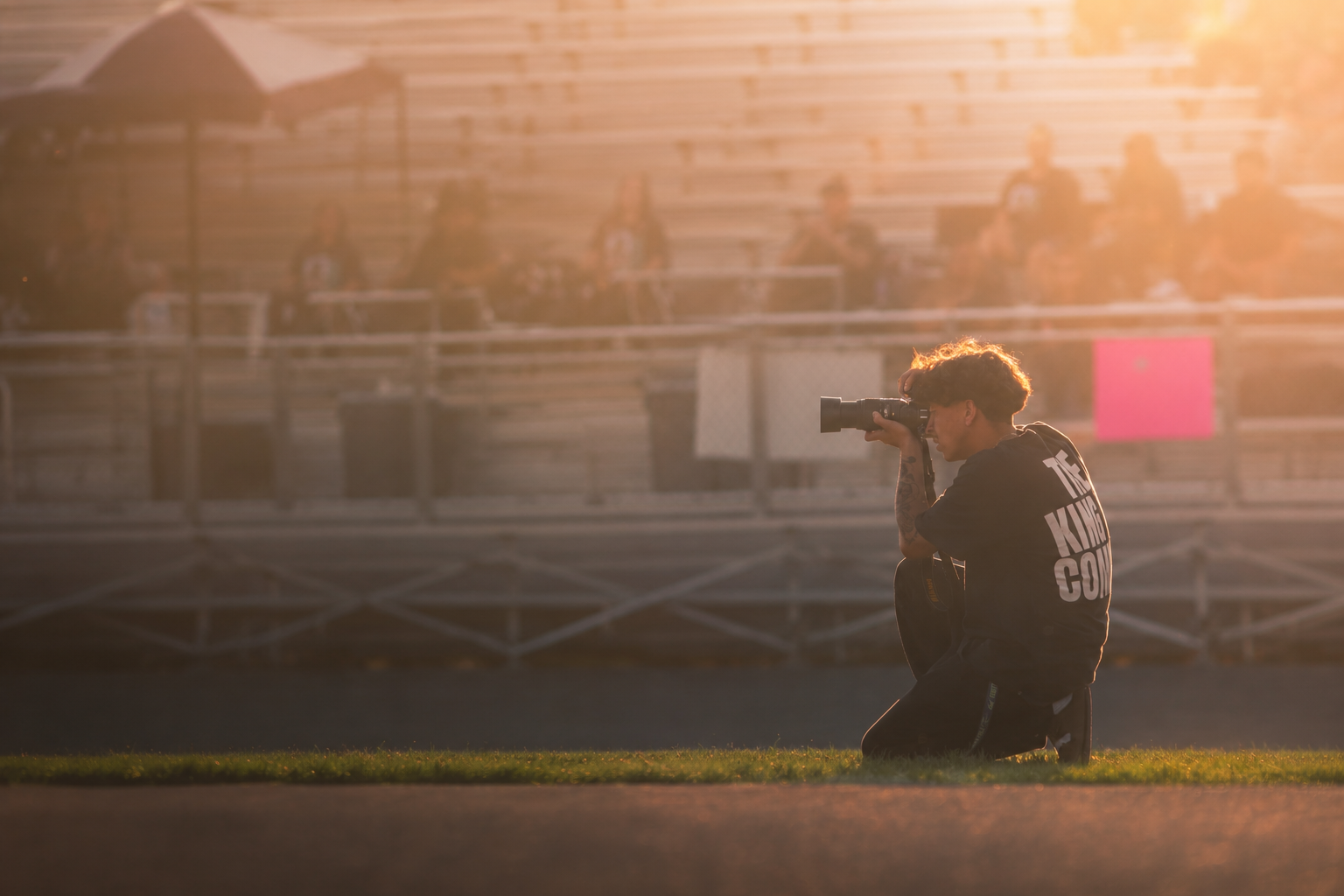 NICK photographing at golden hour on the field